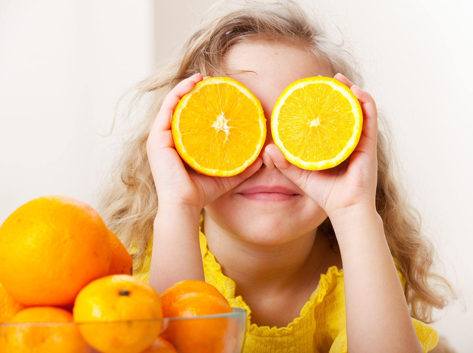 girl oranges on eyes